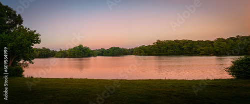 Panoramic sunrise landscape over Cunliff Lake with a view of Star Island from Temple to Music Pavilion at Roger Williams Park in Providence, Rhode Island