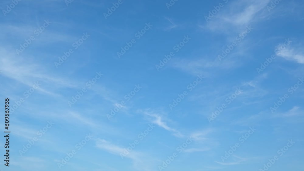 Blue sky time-lapse captures the movement of clouds and color changes in the sky over time. It is often used in films and documentaries to create a sense of time passing or to convey a serene atmosphe Blue sky time-lapse captures the movement of clouds and color changes in the sky over time. It is often used in films and documentaries to create a sense of time passing or to convey a serene atmosphe
