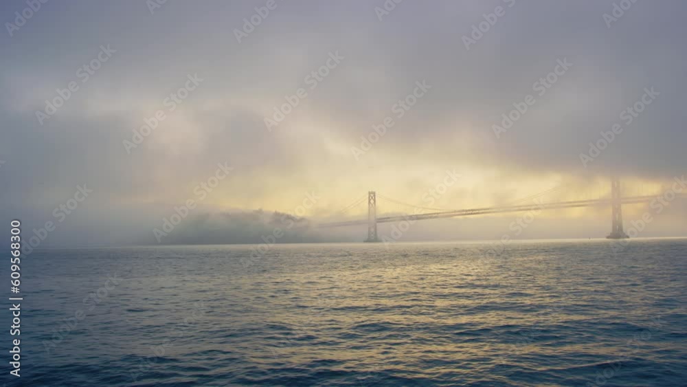 Incredible view of Bay Bridge from San Francisco Bay during striking sunrise Incredible view of Bay Bridge from San Francisco Bay during striking sunrise