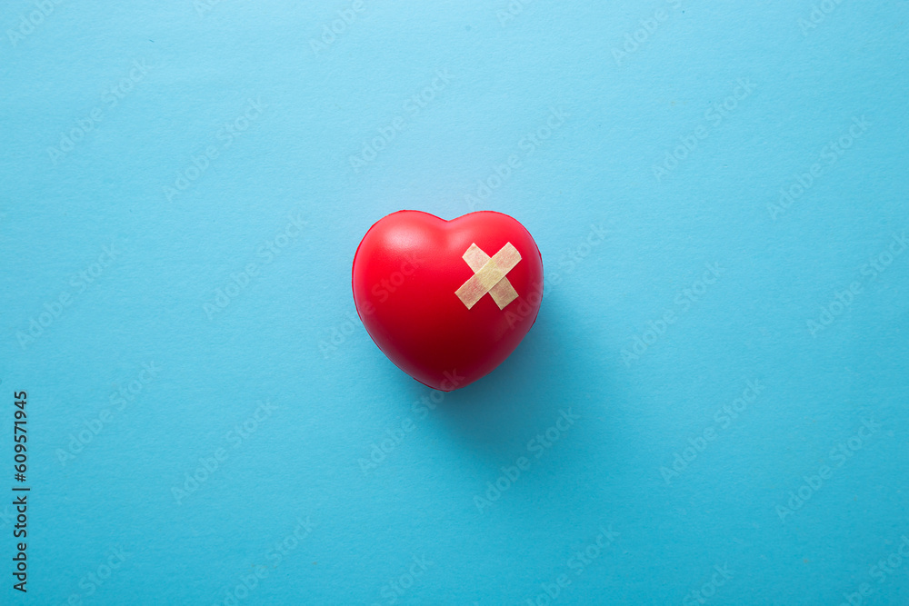 red heart with adhesive plasters, top view. red heart with adhesive plasters, top view.