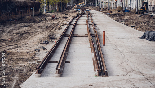 Modernization of old tram tracks on urban construction photo