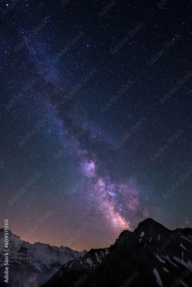 Milky Way and stars in night sky over the Swiss Alps at Lauterbrunnen with Jungfrau peaks