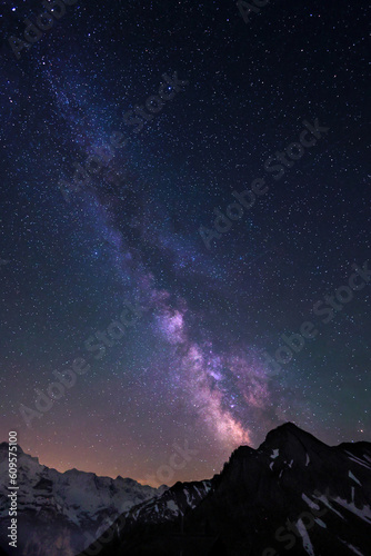 Milky Way and stars in night sky over the Swiss Alps at Lauterbrunnen with Jungfrau peaks © Yü Lan