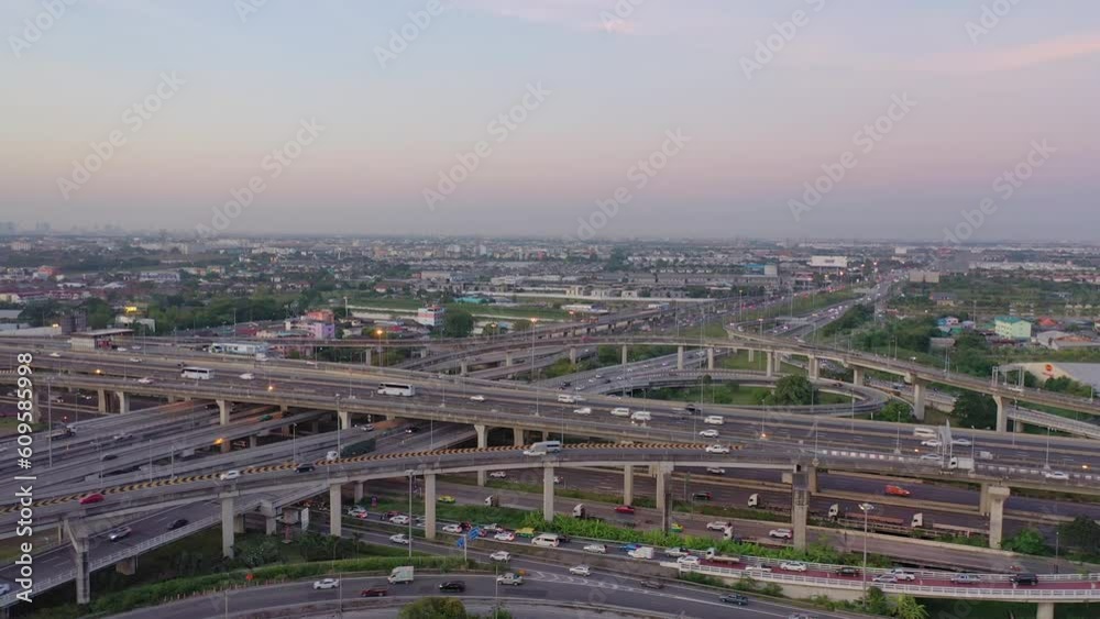 view from drone Smooth traffic on the elevated expressway during dusk