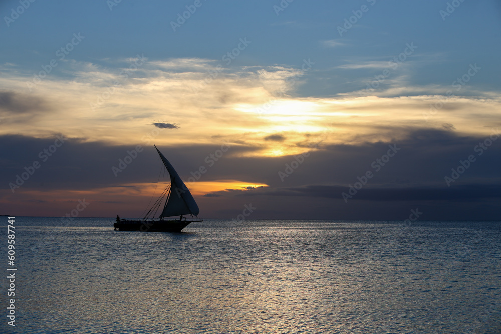 Fototapeta premium Sunset and boats in the sea, sunset on Zanzibar beach