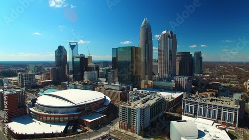 Aerial Shot Of Buildings By Spectrum Center On Sunny Day, Drone Flying Over Modern City Against Sky - Charlotte, North Carolina