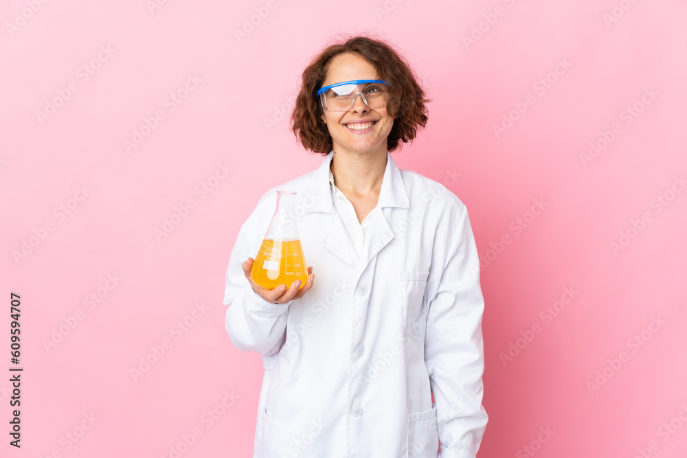 Young English scientific woman isolated on pink background thinking an idea while looking up Young English scientific woman isolated on pink background thinking an idea while looking up