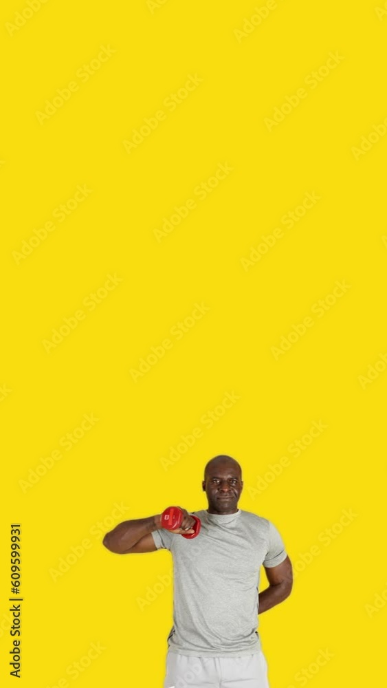 African man doing lateral triceps extension exercises with dumbbells
