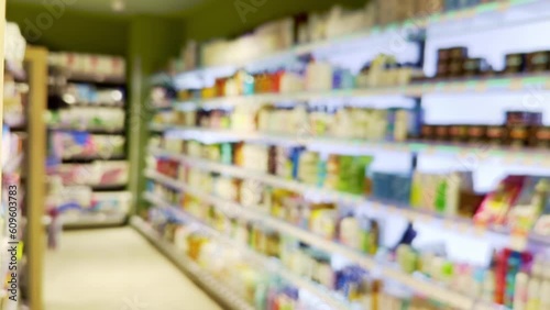Wallpaper Mural Choosing a dairy products at supermarket.Grocery stores .blurred background Torontodigital.ca