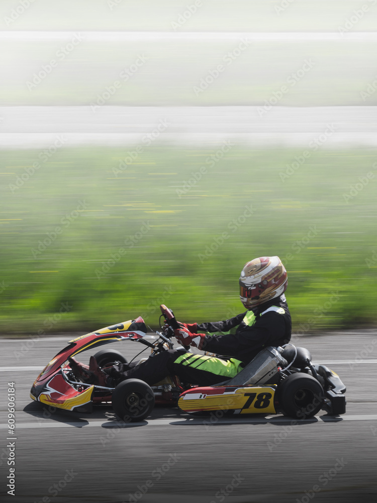 vertical panning of a fast pass of a racing go kart