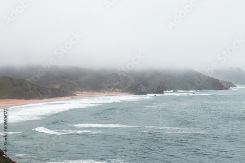Portugal's western coastline of rocky cliffs and sandy beaches in the Odemira region. Wandering along the Fisherman trail on rainy days
