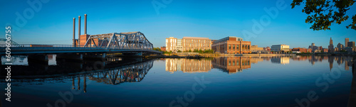 Providence City Skyline, industrial buildings, and River Bridge in Rhode Island, tranquil cityscape over the reflections on the calm water