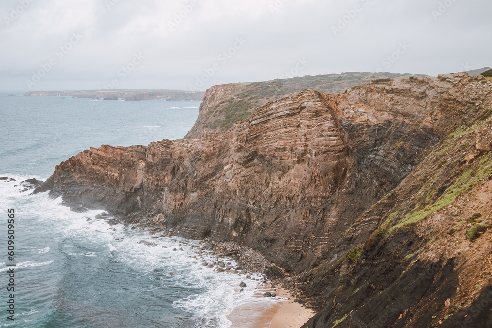 Breathtaking beach of Praia da Manteiga with its high cliffs near Vila Do Bispo, Algarve, Portugal. Wandering the Rota Vicentina. Crossing the west coast
