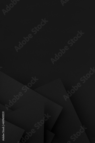 Modern dark black abstract geometric background with pattern of corners, edges and triangles as relief in urban graphic style, for design, flyer, poster, card, text, advertising, vertical.