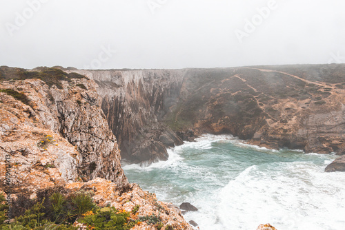 Rocky coastline of the Atlantic Ocean in the south-west of Portugal in the Algarve region. Exploring the beautiful rugged nature of the Fisherman Trail. Cape St. Vincent
