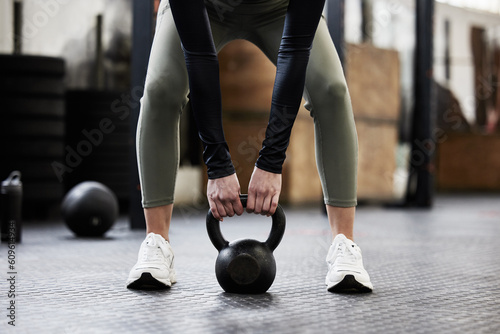Kettle bell, fitness and woman in gym for weightlifting, bodybuilder training and strong muscles. Healthy body, weights and hands of female person in sport center for wellness, exercise and workout
