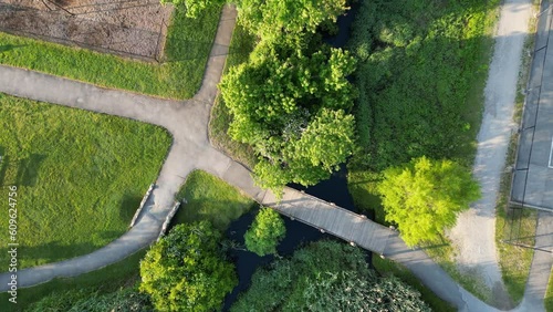 Drone over a small wooden bridge moving down closer in a park off of Park Ave in Babylon Village New Yok. photo