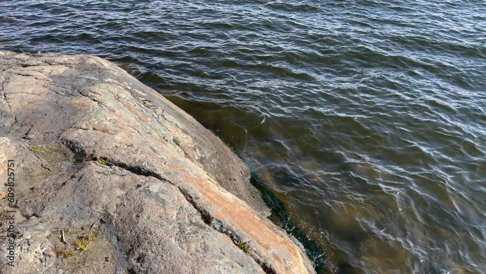 Swedish lake and cliffs. Spring day. Mälaren, Stockholm, Sweden. Swedish lake and cliffs. Spring day. Mälaren, Stockholm, Sweden.