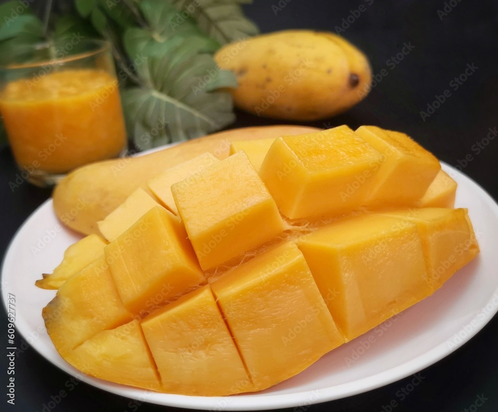 Mango smoothie on black background Mango smoothie on black background