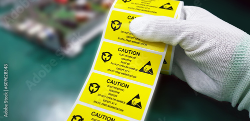 Canvastavla Hand holding ESD symbol label with antistatic gloves,Electrostatic Sensitive Devices (ESD) in electronic industrial