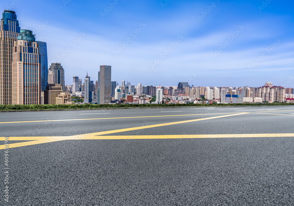 Asphalt pavement and urban building skyline Asphalt pavement and urban building skyline