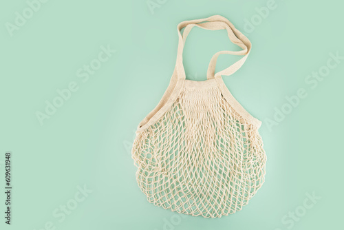 string bag on green natural background,mesh bag for multiple uses, responsible bag, copy space