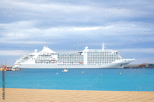 view of a cruise ship docked in the port, concept of vacation at sea, travel on a cruise liner, sightseeing tour of the city, summer vacation
