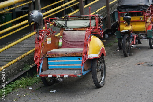 Surakarta, Indonesia -05 May 2023; Becak is a traditional means of transportation, tourist transportation which is still active in the city of Solo.