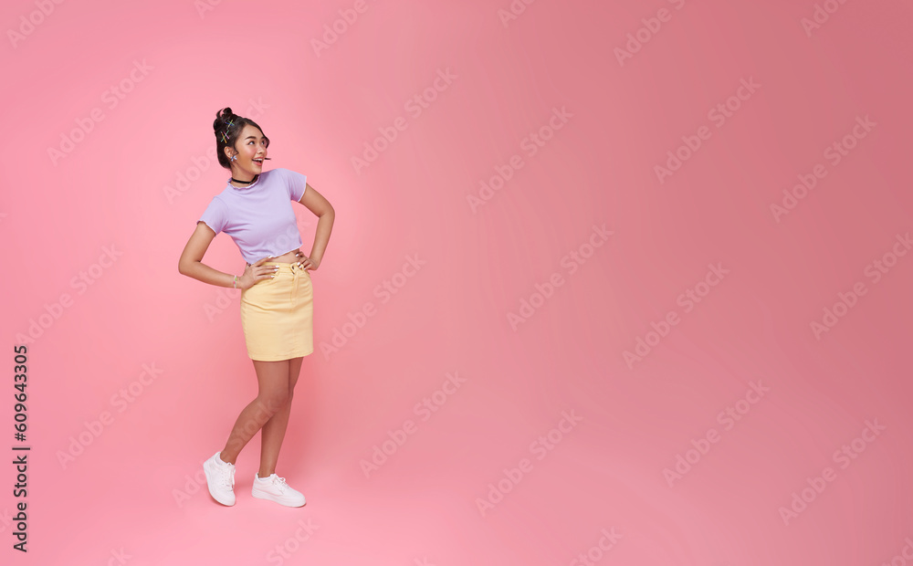 Happy smile Asian woman standing looking away to side with smile on face to isolated on pink copy space studio background.. Happy smile Asian woman standing looking away to side with smile on face to isolated on pink copy space studio background..