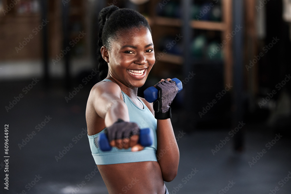 Portrait, dumbbell or happy black woman boxing in training, exercise or  workout for a strong punch