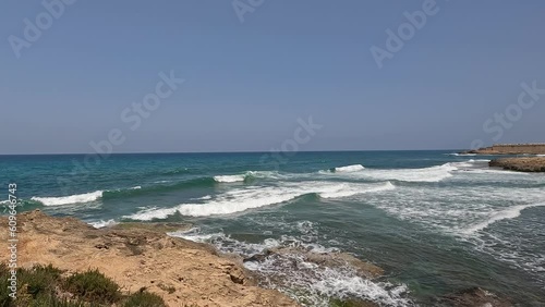 A high angle view on a wild beach  in Israel. The footage shows the sandy coast of Atlit city by the Mediterranean Sea. photo