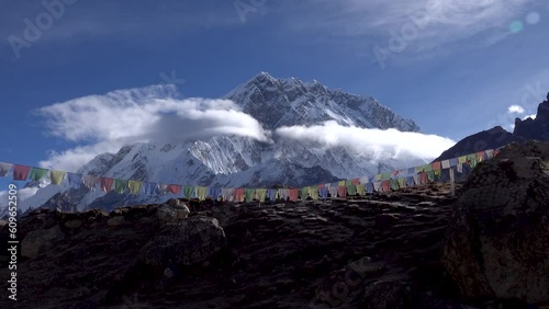 Lhotse Himalaya mountain landscape
perfect view clear blue sky and Tibetan colourful prayer flags
 photo