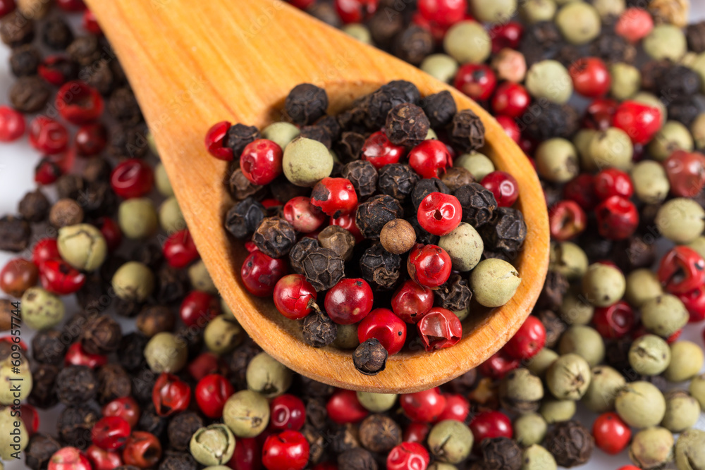 Pepper seasoning mix in wooden spoon Pepper seasoning mix in wooden spoon