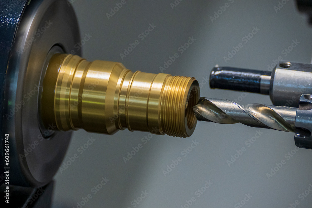 The CNC lathe machine boring cutting the brass material parts by drill tool. The CNC lathe machine boring cutting the brass material parts by drill tool.