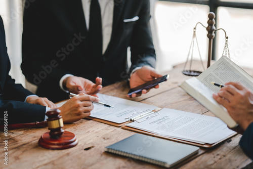 concept of justice and law Judge in courtroom on wooden table and consultant or lawyer working in office. Law advice and justice concept.