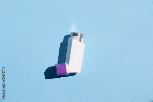 Wallpaper Mural spray for asthma patients on a blue background. inhaler on a blue background. Torontodigital.ca