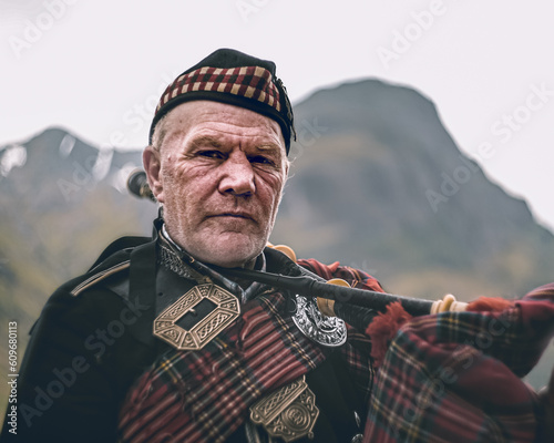 Scottish piper posing in the highlands