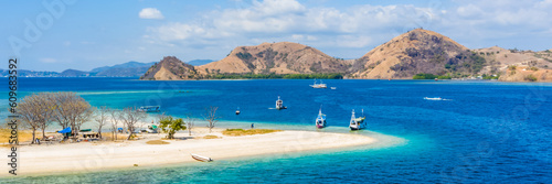 Aerial view of beaches and tourist boat sailing in Kelor Island, Flores Island, Indonesia photo