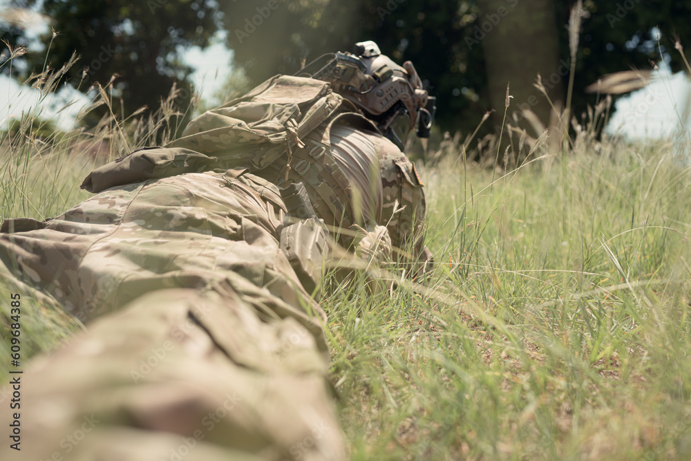 Special forces soldier in camouflage with a pair of weapons that are full of modern technology and complete for battle Special forces soldier in camouflage with a pair of weapons that are full of modern technology and complete for battle