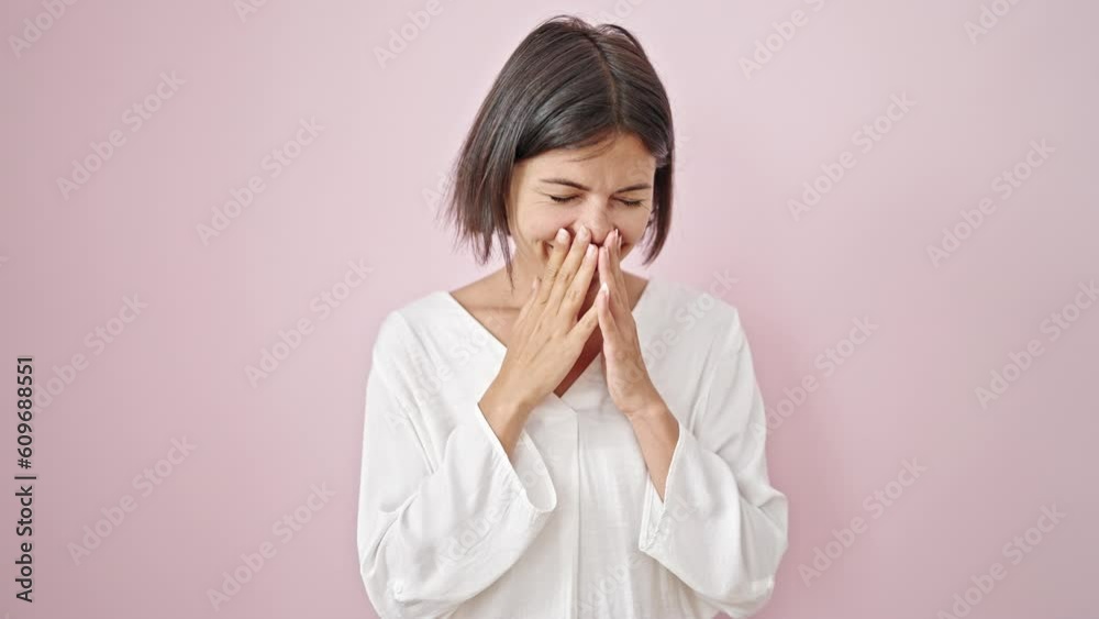 Young beautiful hispanic woman smiling confident sneezing over isolated pink background Young beautiful hispanic woman smiling confident sneezing over isolated pink background