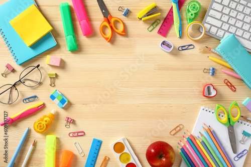 Various colorful school supplies on wooden table. Back to school concept. Flat lay, top view.