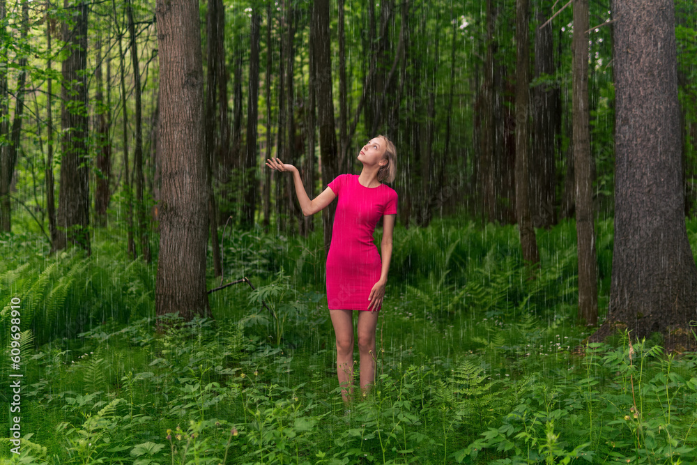 beautiful girl caught in the summer rain while walking in the forest beautiful girl caught in the summer rain while walking in the forest