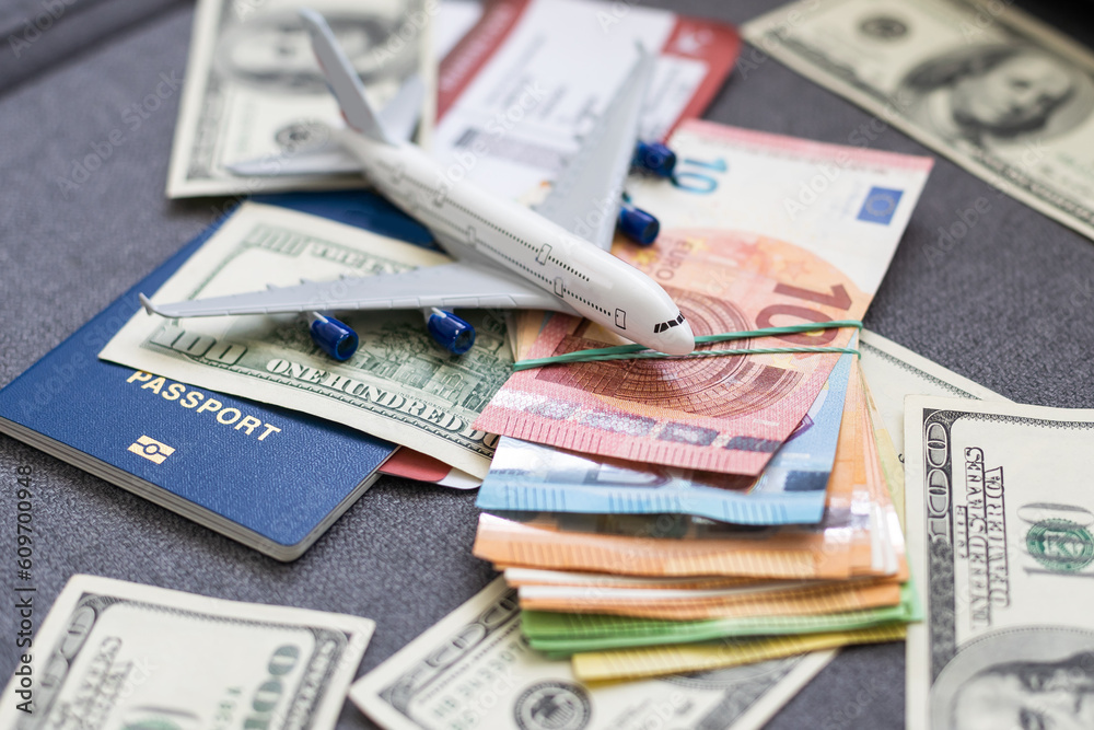 Plane on dollar cash background, travel with airplane concept. Plane on dollar cash background, travel with airplane concept.