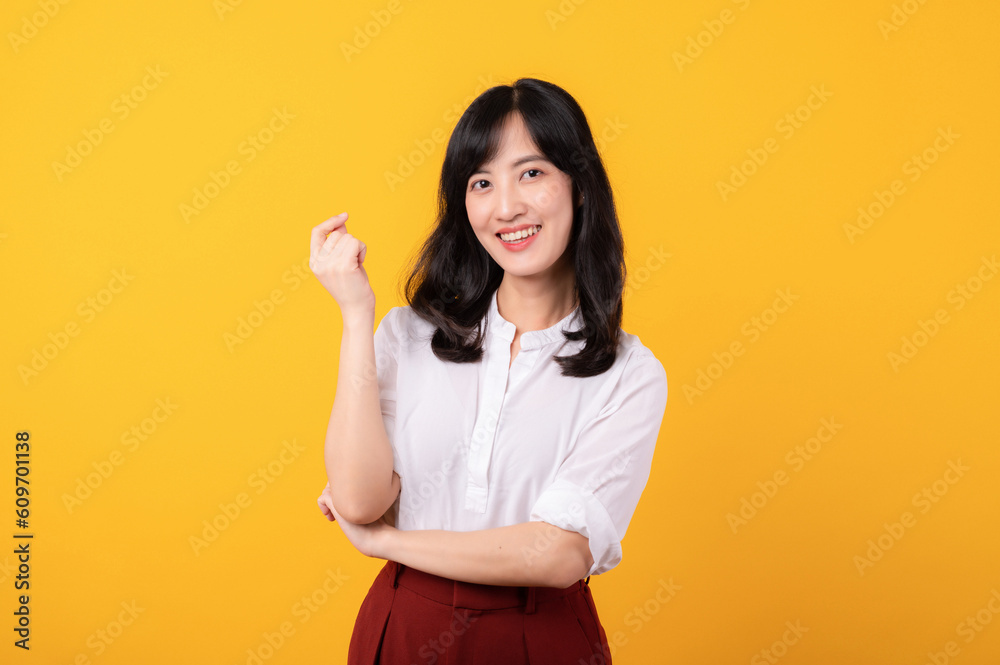 Portrait young beautiful asian woman enterpriser happy smile dressed in white shirt and red plants showing thinking gesture isolated on yellow studio background. Portrait young beautiful asian woman enterpriser happy smile dressed in white shirt and red plants showing thinking gesture isolated on yellow studio background.