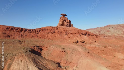 Fly high above Mexican Hat, Utah, and witness the breathtaking beauty of its iconic rock hat formation.