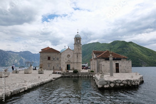 Island of Our Lady of Rock (Gospa od Škrpjela) - an artificial island with ancient church in the Adriatic Sea near town of Perast, Montenegro. photo