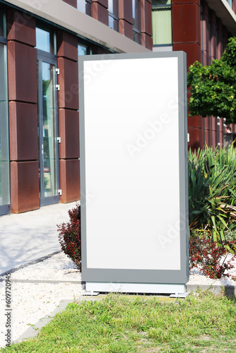 Blank white vertical light box sign mockup photo image. Clear banner on a street mock up template.