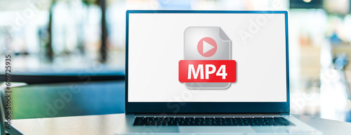 Laptop computer displaying the icon of MP4 file photo