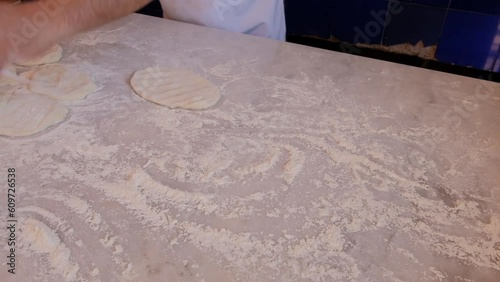 the preparation of the bread of Bafra style pide which is a Turkish pizza with meat