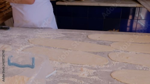 the preparation of the bread of Bafra style pide which is a Turkish pizza with meat